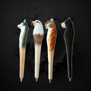 Assorted Hand Carved Wooden Animal Pens In Display